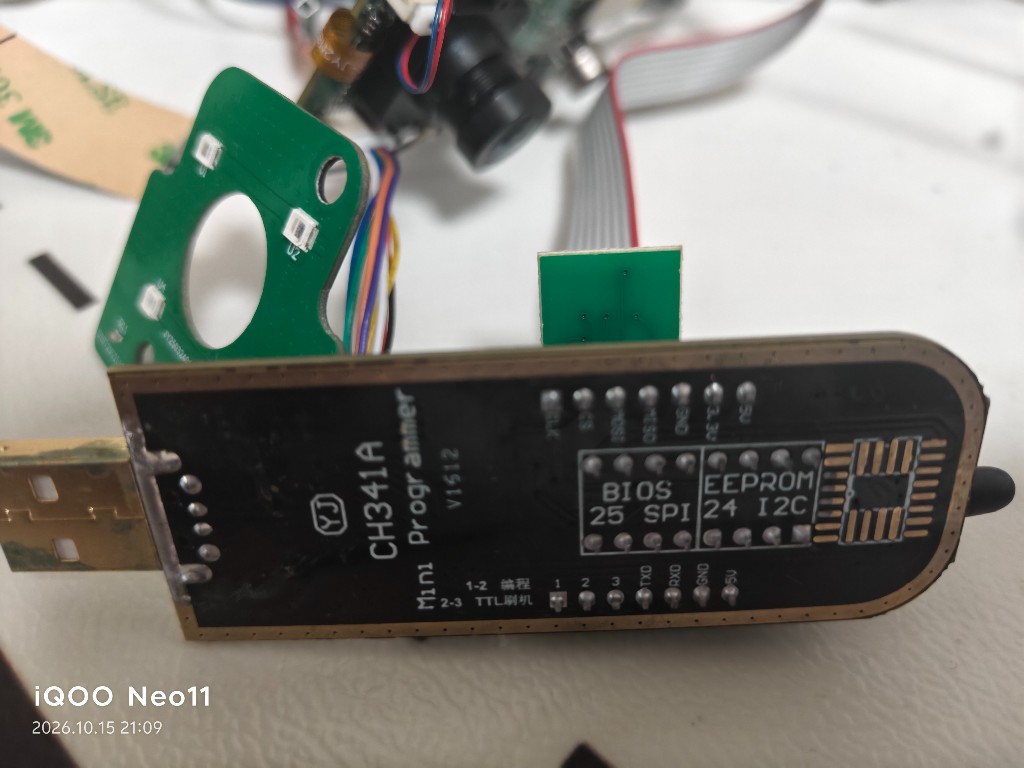 CH341A Mini Programmer with the green adapter seated on the BIOS 25 SPI header
